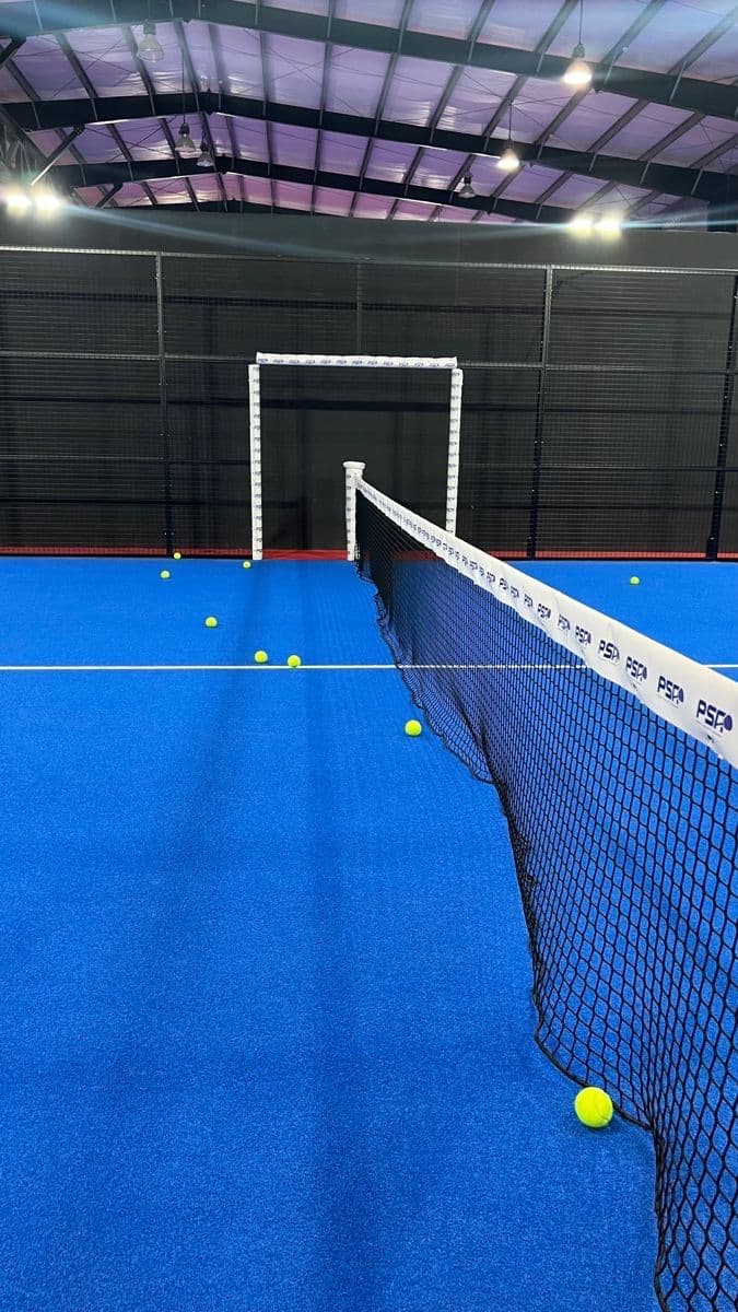 Padel court with racket