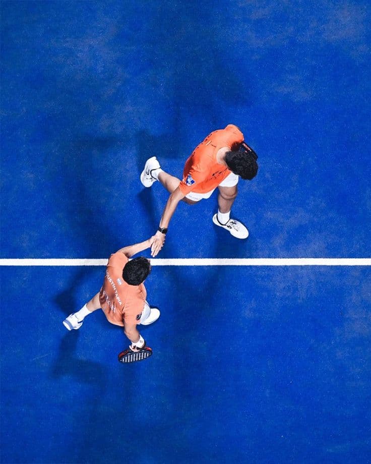 Player with padel racket in hand